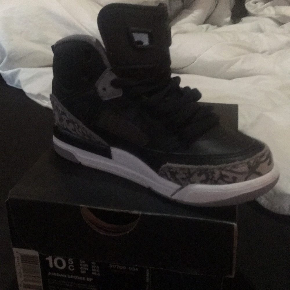 A pair of black white Jordan’s